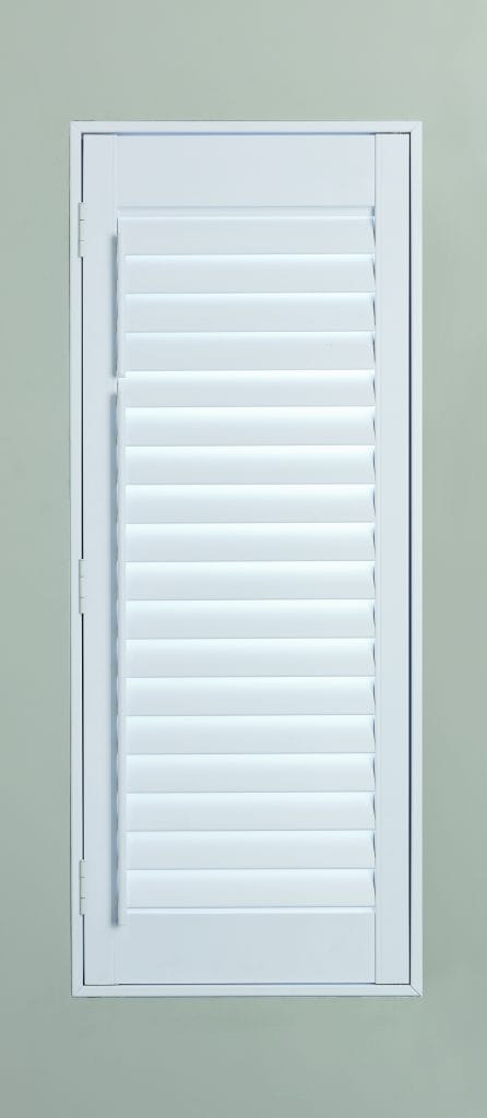 Solid panel plantation shutters in a closed position, providing complete privacy and blackout
