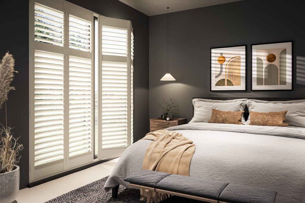 White plantation shutters in a calm, hotel-style bedroom by Coventry Blinds
